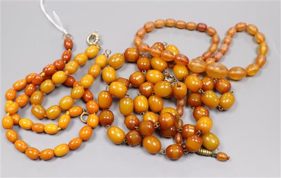 A single strand amber bead necklace, gross 15 grams, one clear amber necklace and two amberoid items.